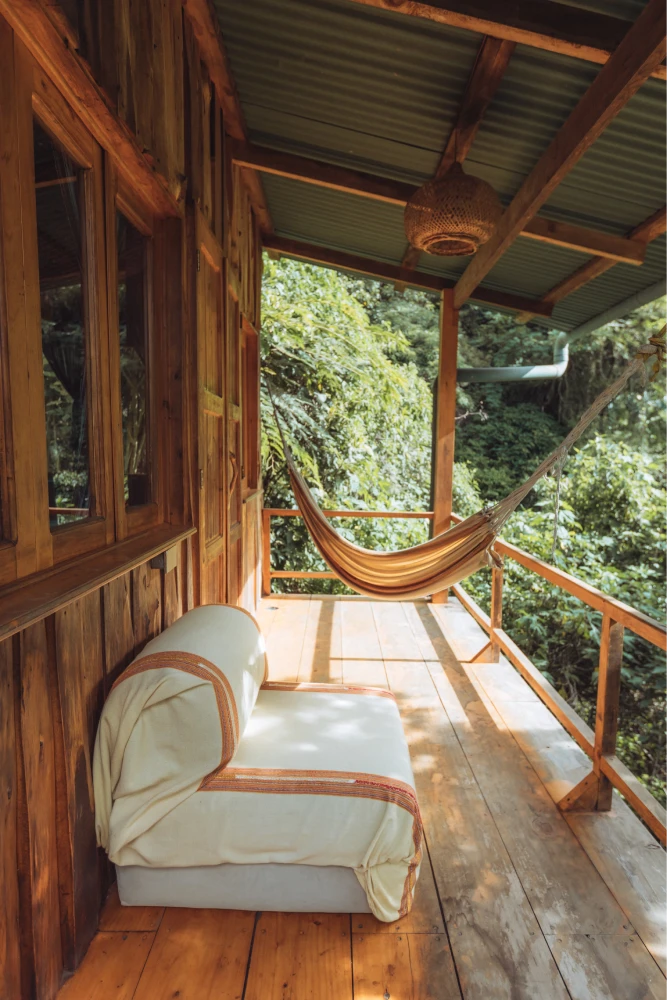 KawoqForest-Bungalow-Cabin-Outside-Terrace-Space-Couch